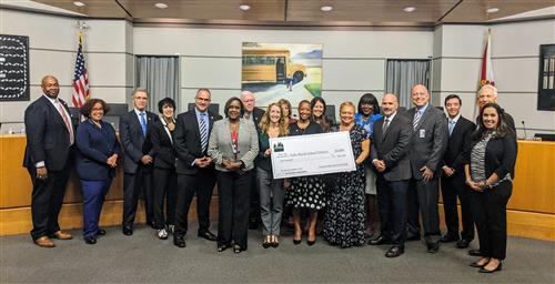 Palm Beach receives award at recent school board meeting. 
