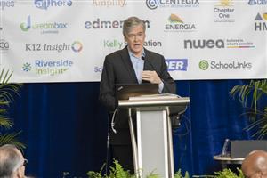 John Harwood on stage addresseing CGCS legislative and policy conferees