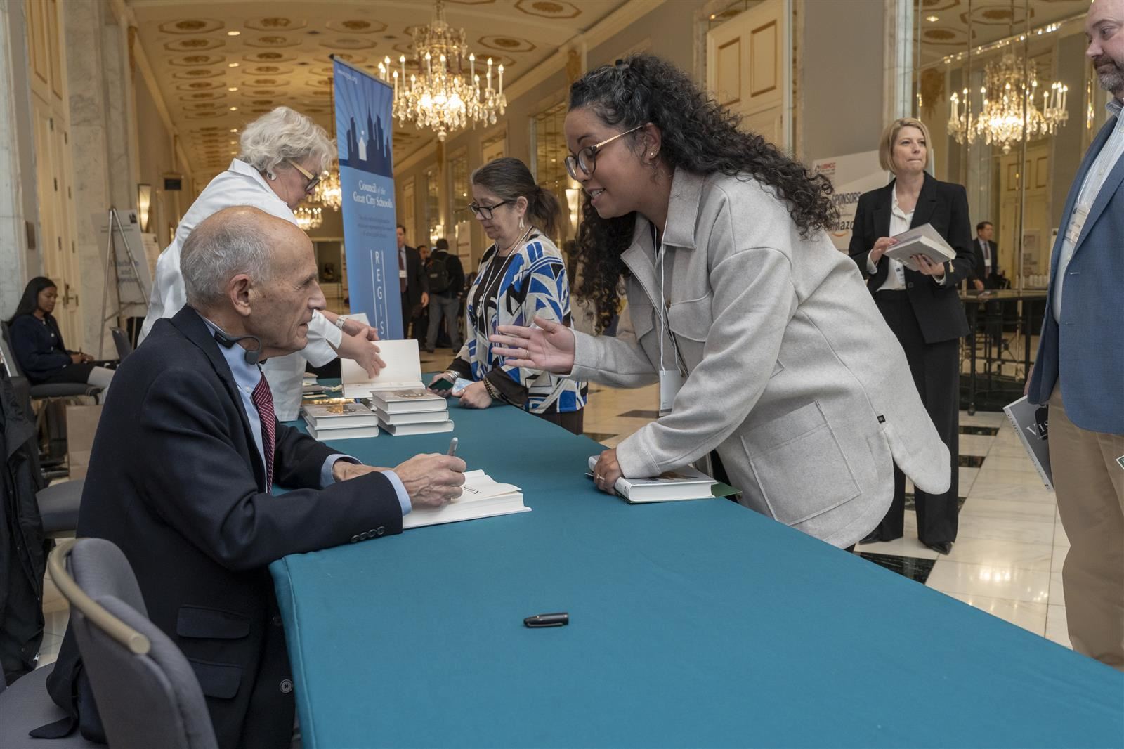 Judge Tatel speaking with a conference attendee