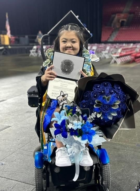 Zoey Ngu Holding her diploma