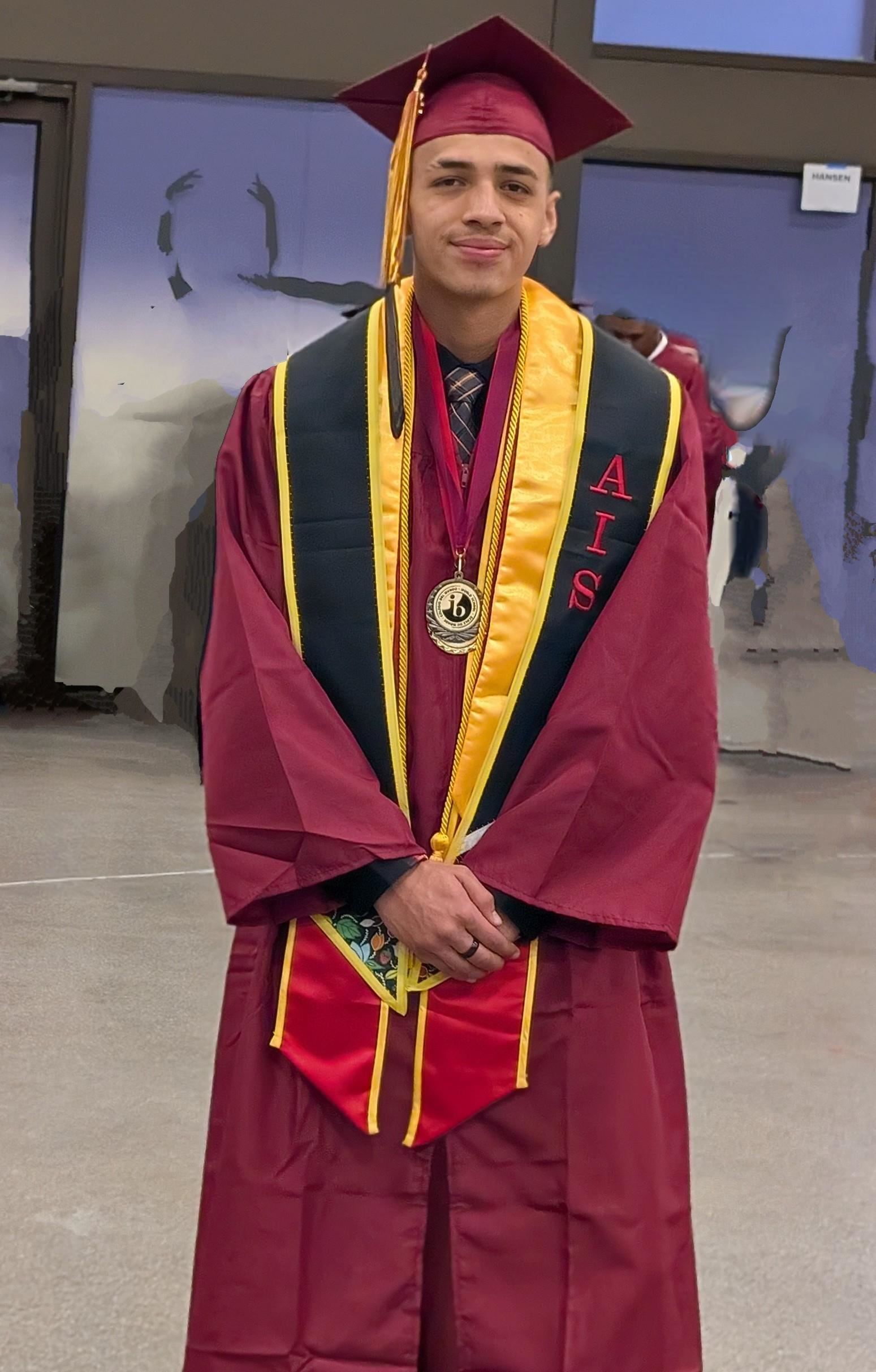 William Rubio in his cap and gown for graduation